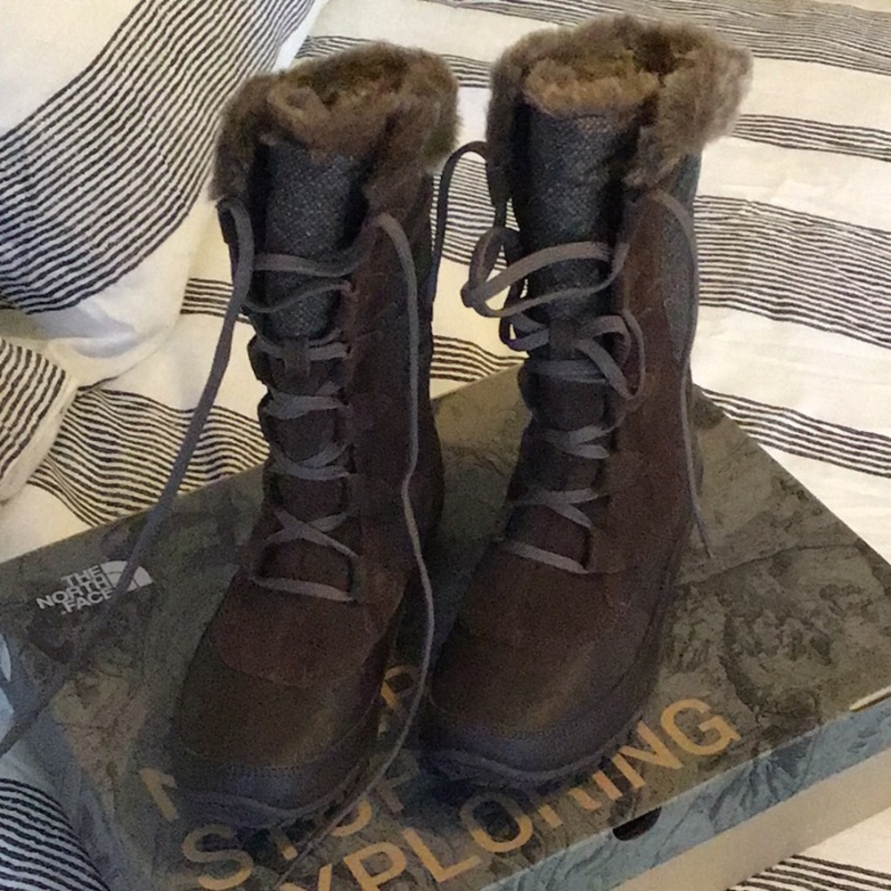 Never worn North Face Nuptse Purna boots